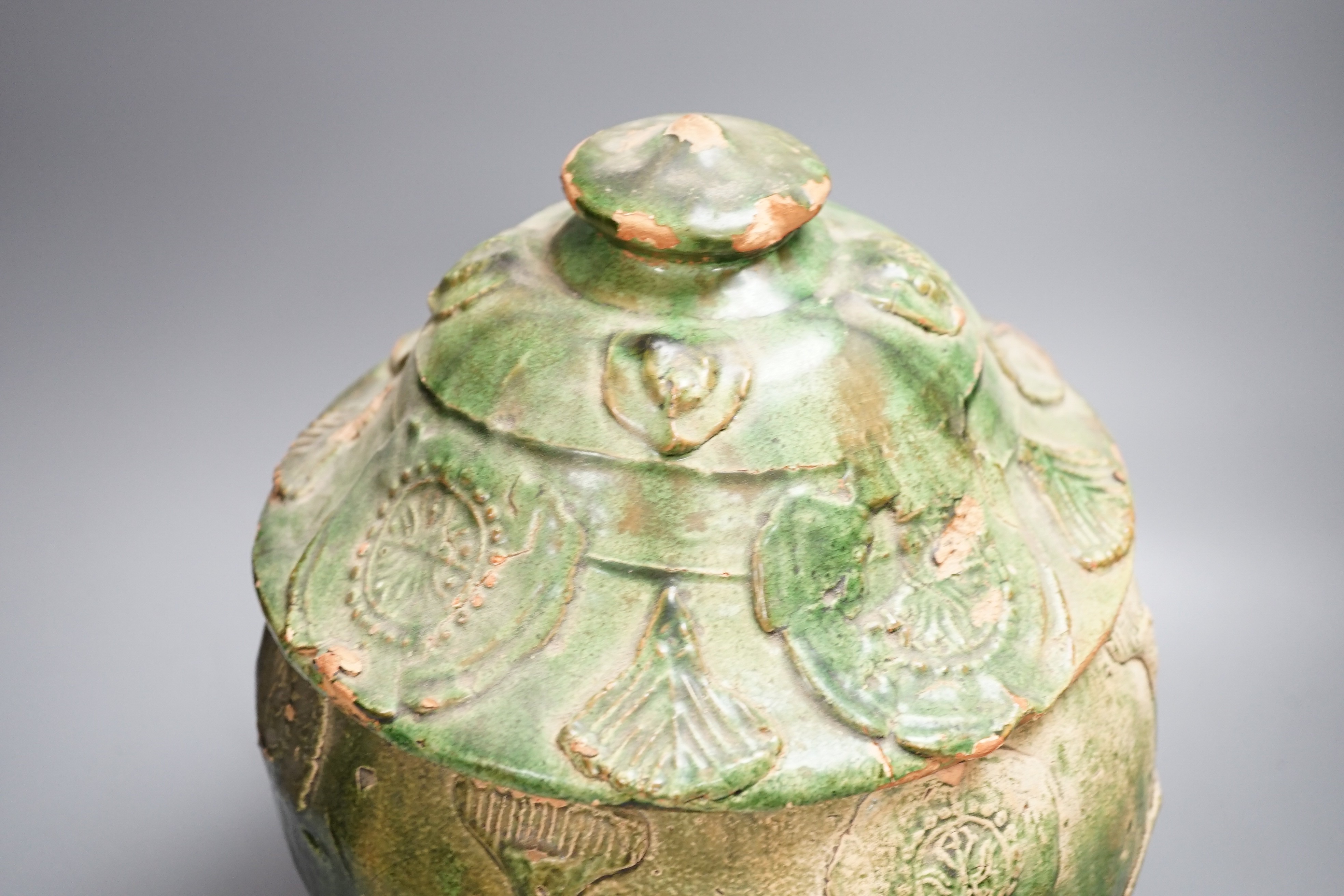 A large Chinese green glazed jar and cover, Liao dynasty, 35cm high